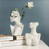 Designer ceramic vase with stylized face motif